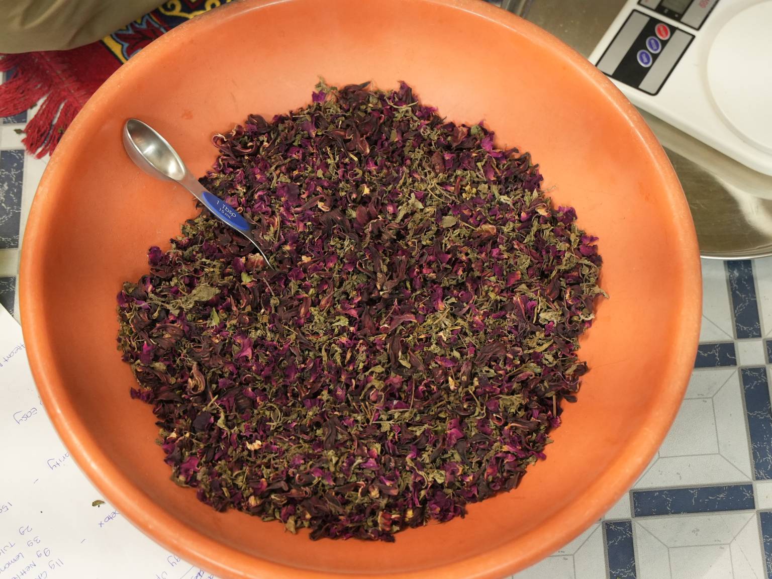 Dried Heart Bloom botanicals in a blending tub